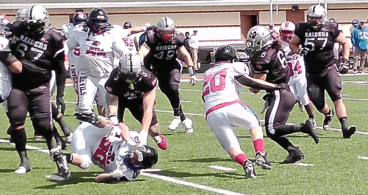 Racine Raiders dominate in MWUFL debut behind Carothers’ special-teams heroics