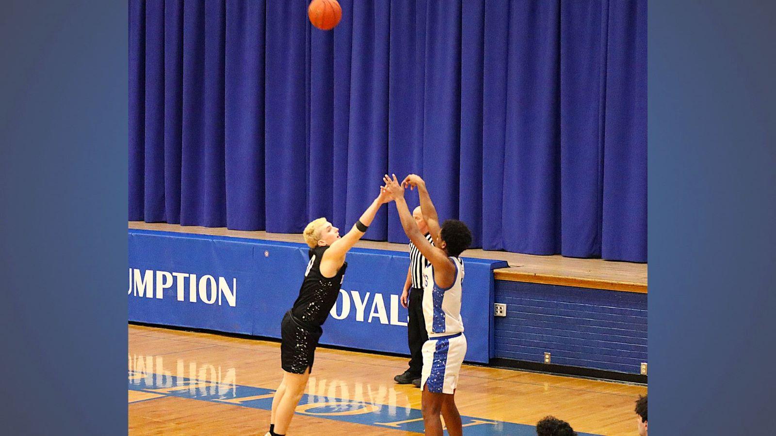 Assumption senior breaks a record in basketball