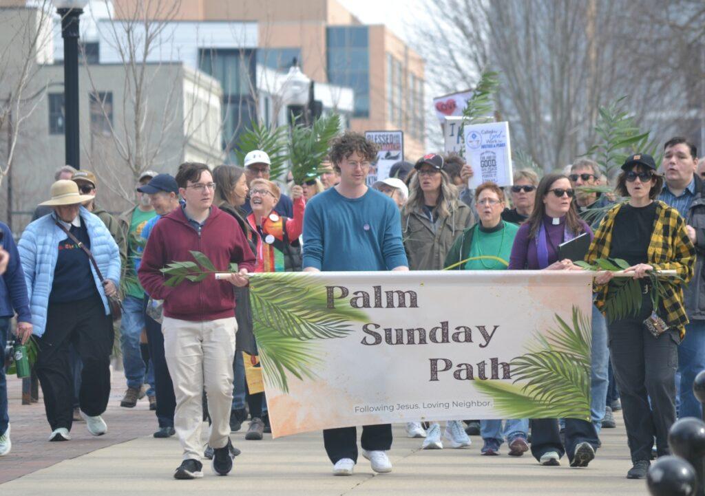 In a sermon on foot directed at Donald Trump, hundreds join Palm Sunday Path at state Capitol